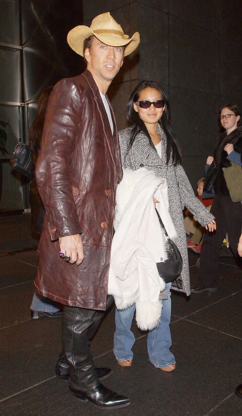 <p>Wow. Nicolas Cage and his wife, Alice Kim, leave a midtown hotel for the airport on November 19, 2004 in New York City. </p>
