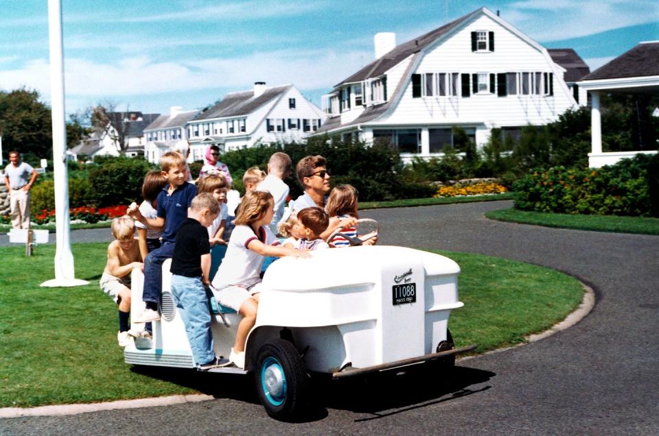 september 1962 weekend at hyannis port president kennedy drives nieces and nephews in golf cart