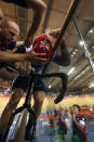 LONDON, ENGLAND - AUGUST 02: Sir Chris Hoy of Great Britain is aided with removing his helmet after setting a new world record in the Men's Team Sprint Track Cycling final on Day 6 of the London 2012 Olympic Games at Velodrome on August 2, 2012 in London, England. (Photo by Bryn Lennon/Getty Images)