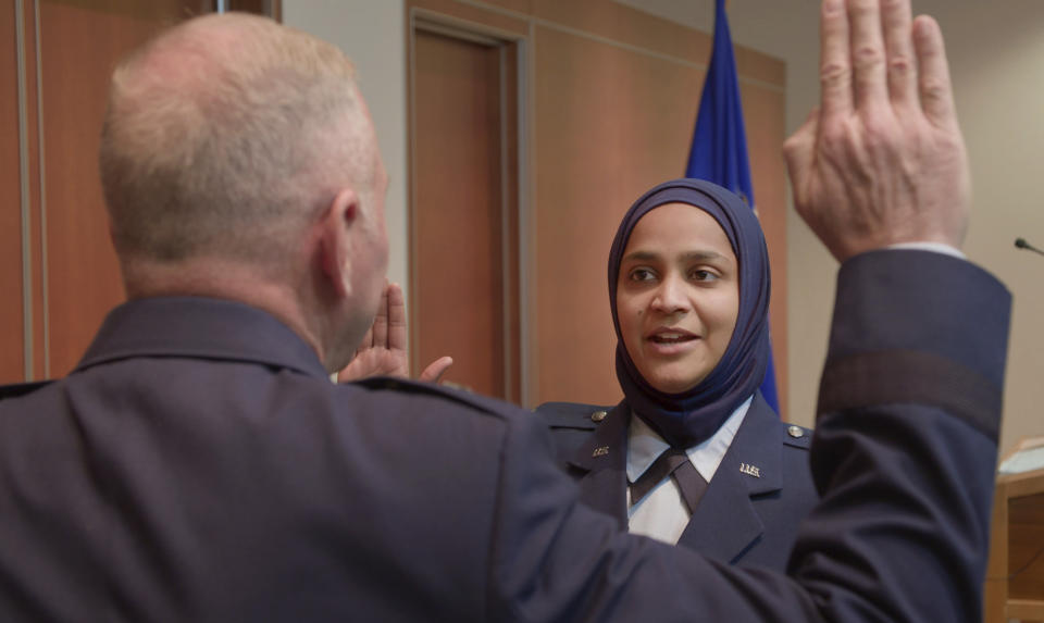 This still image provided by Terrace Films shows Saleha Jabeen taking an oath to enter Air Force Chaplain Corps at the Catholic Theological Union, in December 2019, in Chicago. Jabeen is featured in "Three Chaplains," a documentary that offers a peek into the worlds of Muslim military chaplains. (Courtesy David Washburn/Terrace Films via AP)