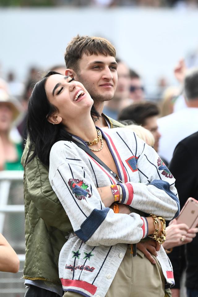 Dua Lipa In Ashley Williams Sweater & Louis Vuitton Headscarf