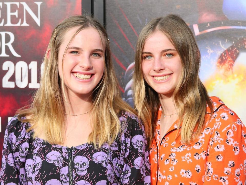 Cali and Noelle Sheldon pose on the red carpet at the premiere of "Us."
