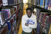 Illinois Institute of Technology student Wofai Ewa, originally from Nigeria, poses for a portrait Friday, Sept. 18, 2020, at the institute's library in Chicago. America was always considered the premiere destination for international students, with the promise of top-notch universities and work opportunities. Yet, 2016 marked the start of an alarming decline of new enrollees, something expected to continue with fresh rules limiting student visas, competition from other countries and a haphazard coronavirus response. (AP Photo/Charles Rex Arbogast)