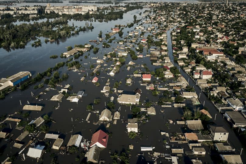 Streets are flooded in Kherson after the walls of the Kakhovka dam collapsed, June 2023