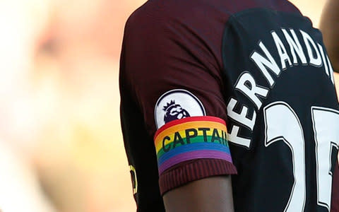 First openly gay referee Ryan Atkin says rainbow laces are a start, but key players in football must do more to support LGBT people  - Credit: Reuters