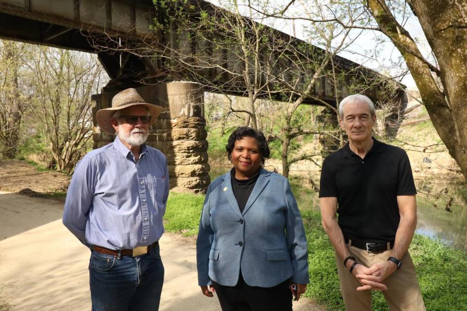 Shelby County farmer Doug Welch, left, NAACP chapter president Janice Harris, center, and First Christian Church senior minister Dave Charlton, right, stand near the train trestle bridge over Clear Creek in Shelbyville where three black inmates were dragged out of the cityÕs old jail and lynched in 1911. The city plans to unveil three markers outside of the old jail downtown to note the cityÕs 6 lynchings from 1878 to 1911. April 7, 2021.