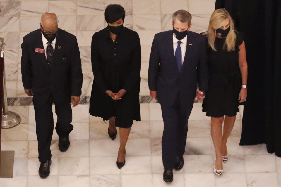 Georgia state Rep. Calvin Smyre, Atlanta Mayor Keisha Lance Bottoms, Gov. Brian Kemp and his wife Marty Kemp, from left, walk ahead of the casket of Rep. John Lewis at the state capital, Wednesday, July 29, 2020, in Atlanta. Lewis, who carried the struggle against racial discrimination from Southern battlegrounds of the 1960s to the halls of Congress, died Friday, July 17, 2020. (AP Photo/John Bazemore, Pool)