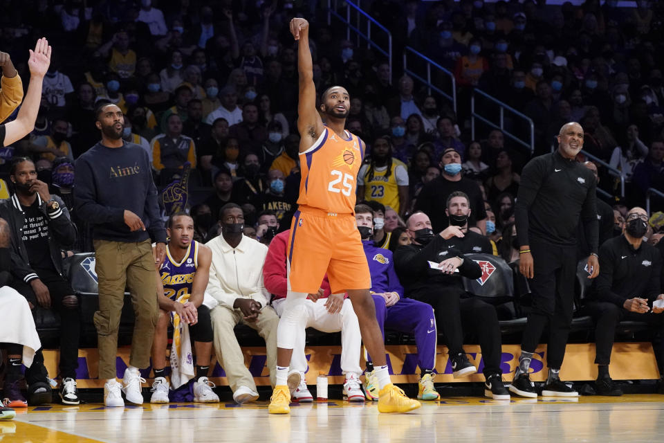 Phoenix Suns forward Mikal Bridges (25) reacts after making a three-point basket during the first half of an NBA basketball game against the Los Angeles Lakers, Friday, Oct. 22, 2021, in Los Angeles. (AP Photo/Marcio Jose Sanchez)