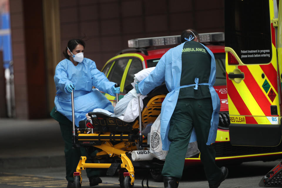 A patient is transported outside the Royal London Hospital on Thursday. (Yui Mok/PA)