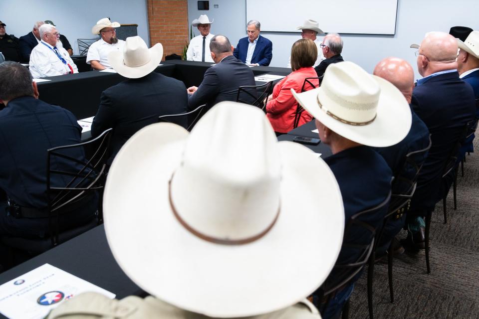 Texas Gov. Greg Abbott participates in a roundtable discussion with local law enforcement officials at the Solomon P. Ortiz International Center in Corpus Christi, Texas, on Thursday, Oct. 20, 2022. Abbott discussed immigration and drug trafficking in a closed door meeting before holding a press conference.