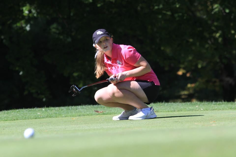 New Albany's Allison Weisbrod reacts to her putt on No. 12 during the Division I district tournament Monday at the Links at Echo Springs.