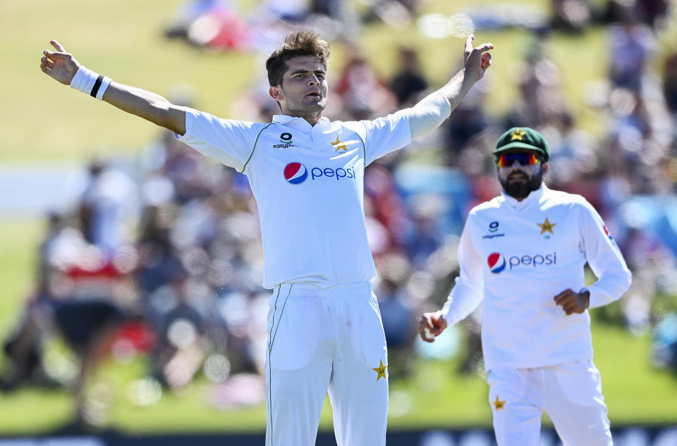 Pakistan bowler Shaheen Afridi celebrates the wicket of New Zealand batsman Ross Taylor during play on day one of the first cricket test between Pakistan and New Zealand at Bay Oval, Mount Maunganui, New Zealand, Saturday, Dec. 26, 2020. (Andrew Cornaga/Photosport via AP)