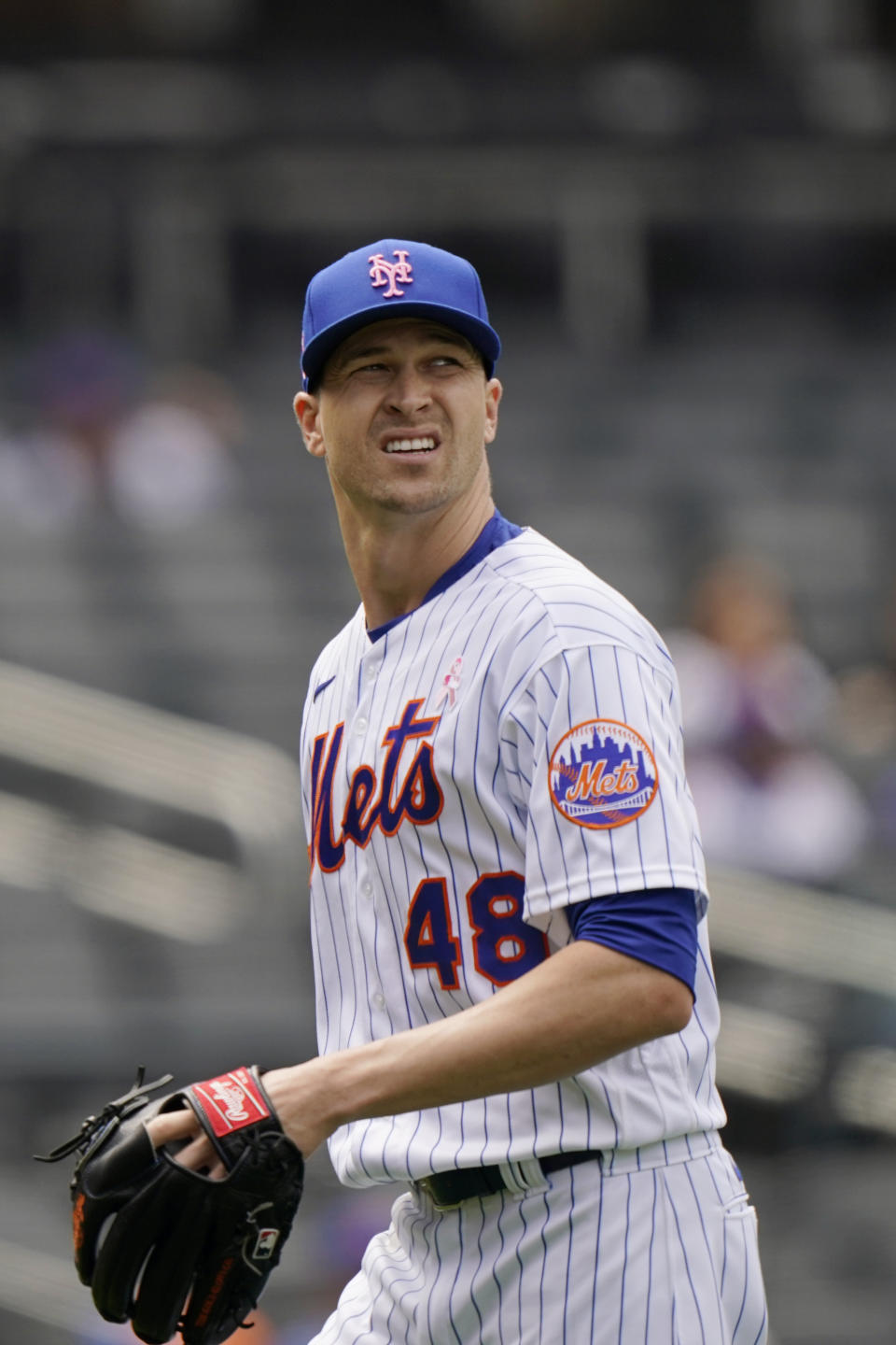 New York Mets starting pitcher Jacob deGrom leaves the field against the Arizona Diamondbacks, Sunday, May 9, 2021, in New York. deGrom left the game in the sixth inning after throwing only two warmup pitches. (AP Photo/Kathy Willens)