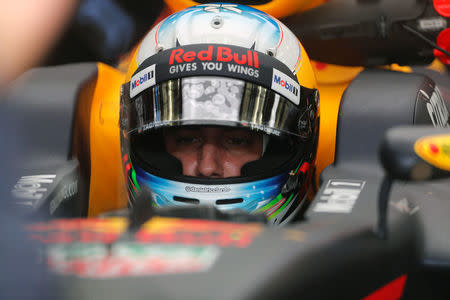 Formula One - F1 - Bahrain Grand Prix - Sakhir, Bahrain - 14/04/17 - Redbull Formula One driver Daniel Ricciardo of Australia gets in his car during the first practice session of the Bahrain F1 Grand Prix. REUTERS/Hamad I Mohammed