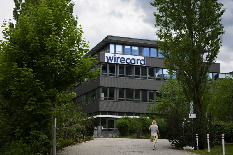 FILE PHOTO: A woman enters the headquarters of Wirecard AG in Aschheim