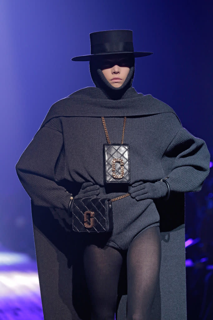 <p>A model wears a black quilted bag necklace and belt bag from the Marc Jacobs FW18 show. (Photo: Getty Images) </p>