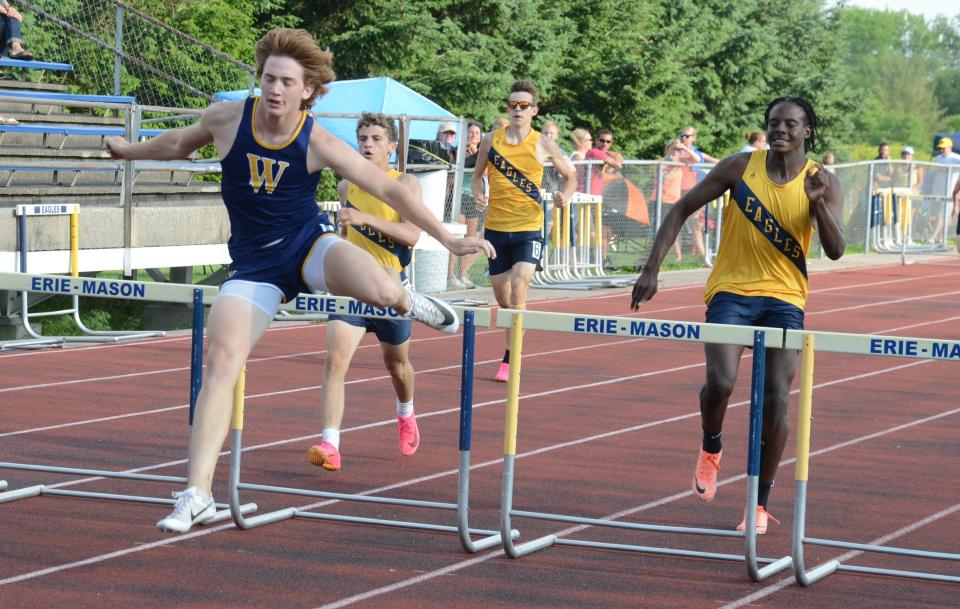 Whiteford's Ryin Ruddy wins the low hurdles at the Tri-County Conference track and field championships on Tuesday, May 21, 2024.