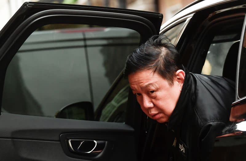 Myanmar's ambassador Kyaw Zwar Minn leaves in a car outside the Myanmar Embassy in London