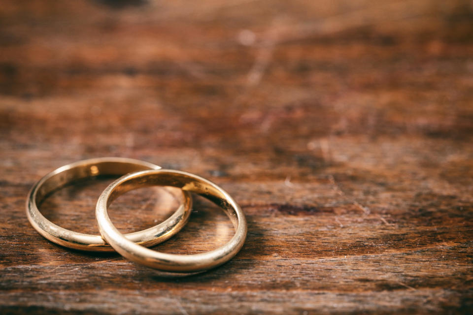 Two wedding bands sit on a table