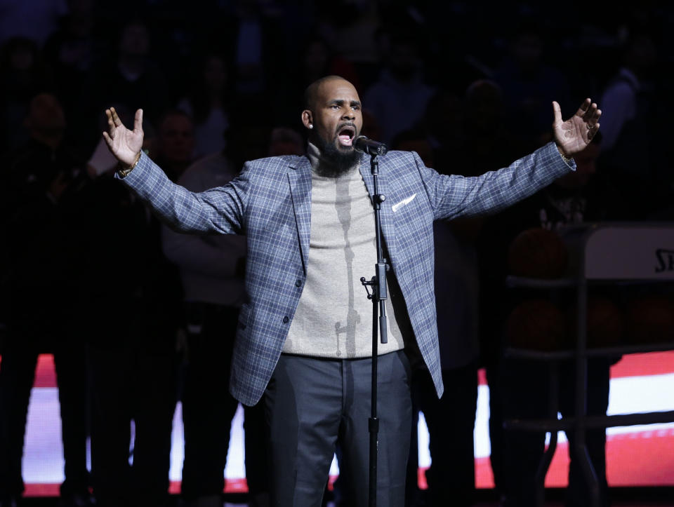 FILE - In this Nov. 17, 2015, file photo, R. Kelly performs the national anthem before an NBA basketball game between the Brooklyn Nets and the Atlanta Hawks in New York. A federal jury in New York convicted the R&B superstar Monday, Sept. 27, 2021, in a sex trafficking trial. (AP Photo/Frank Franklin II, File)