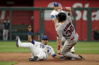 Boston Red Sox's Christian Arroyo (39) is caught stealing second by Kansas City Royals second baseman Nicky Lopez (8) during the sixth inning of a baseball game Saturday, Aug. 6, 2022, in Kansas City, Mo. (AP Photo/Charlie Riedel)