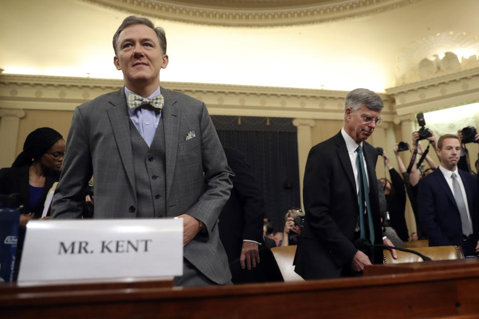 Top U.S. diplomat in Ukraine William Taylor, right, and career Foreign Service officer George Kent, arrive to testify before the House Intelligence Committee on Capitol Hill in Washington, Wednesday, Nov. 13, 2019, during the first public impeachment hearing of President Donald Trump's efforts to tie U.S. aid for Ukraine to investigations of his political opponents. (AP Photo/Andrew Harnik)