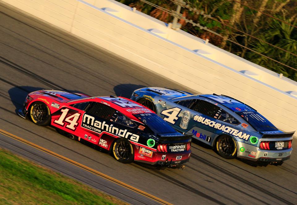 Mitchell's Chase Briscoe (14) duels side-by-side with Stewart-Haas Racing teammate Kevin Harvick in the Daytona 500. The drivers will be back in action Sunday in the Coca-Cola 600 at Charlotte.