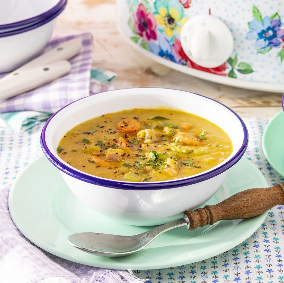 slow cooker split pea soup in white bowl with blue edge