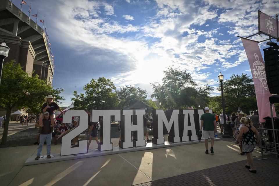 Sep 17, 2022; College Station, Texas; A view of the fans posing for a photo with the 12th Man logo before the game between the Texas A&M Aggies and the Miami Hurricanes at Kyle Field. Jerome Miron-USA TODAY Sports