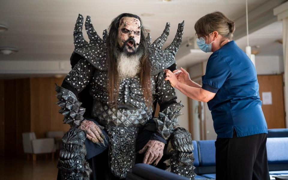 Mr Lordi, of the Finnish hard rock band Lordi, receives his second Covid-19 vaccination from nurse Paula Ylitalo in Rovaniemi, Finland on 1 August 2021 - Jouni Porsanger/Lehtikuva