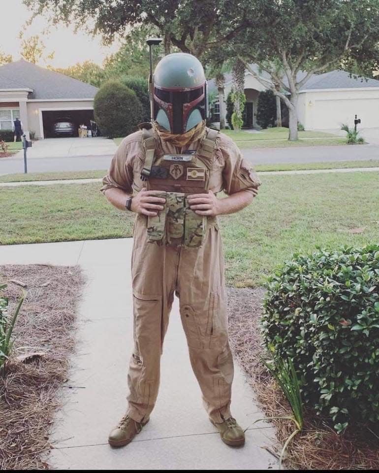 Panama City's Dylan Horn, a huge Star Wars fan, poses in a Boba Fett helmet. Horn was killed in a helicopter crash more than a week ago.