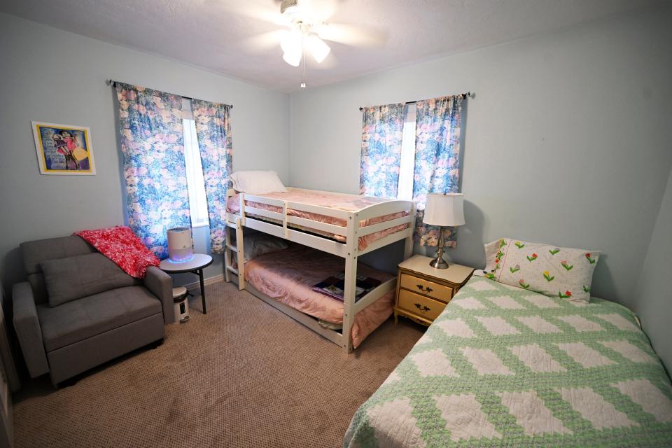 This room at Francis House, which has a twin bed, a bunk bed and a chair that pulls out into a child’s bed, could accommodate as many as four children.