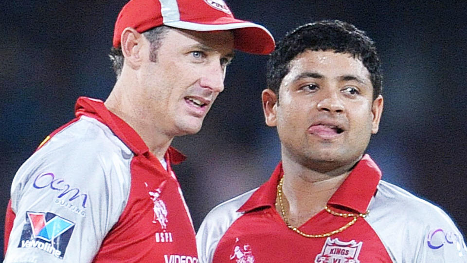 David Hussey, pictured here talking with Piyush Chawla during an IPL game in 2012.