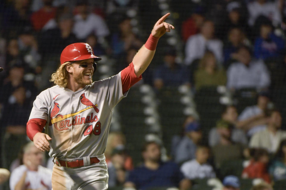 St. Louis Cardinals' Harrison Bader celebrates scoring during the 11th inning on a double by Brendan Donovan during a baseball game, Sunday, June 5, 2022, at Wrigley Field in Chicago. (AP Photo/Mark Black)