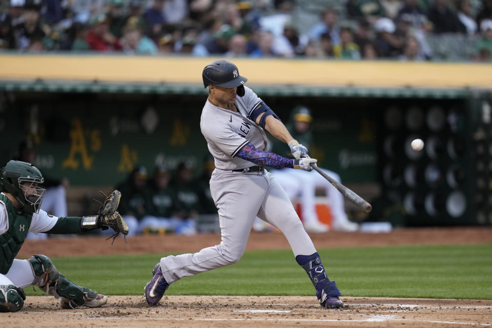 New York Yankees' Giancarlo Stanton hits a solo home run against the Oakland Athletics during the fourth inning of a baseball game in Oakland, Calif., Wednesday, June 28, 2023. (AP Photo/Godofredo A. Vásquez)