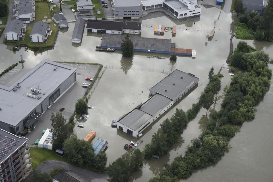 The center of Hokksund and the surrounding area hit by floodwater in southeast Norway, Friday Aug. 11. 2023. More evacuations were being considered Friday in southeastern Norway, where the level of water in swollen rivers and lakes continued to grow after days of torrential rain. (Ole Berg-Rusten/NTB via AP)