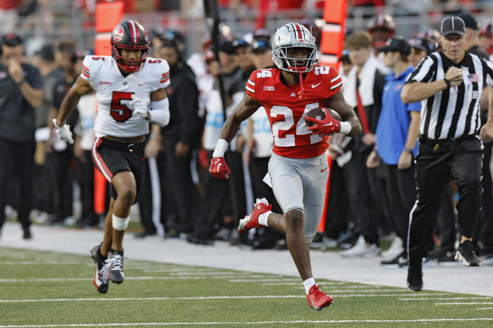 Ohio State receiver Nolan Baudo, right, outruns Western Kentucky defensive back Rome Weber to score a touchdown during the second half of an NCAA college football game, Saturday, Sept. 16, 2023, in Columbus, Ohio. (AP Photo/Jay LaPrete)