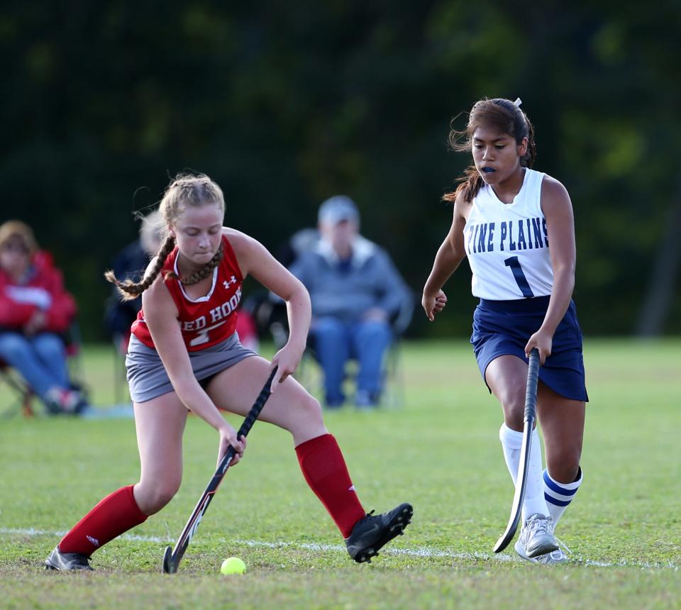 Red Hook's Liv Christensen looks to pass up field against Pine Plains during a Sept. 29, 2021 field hockey game.