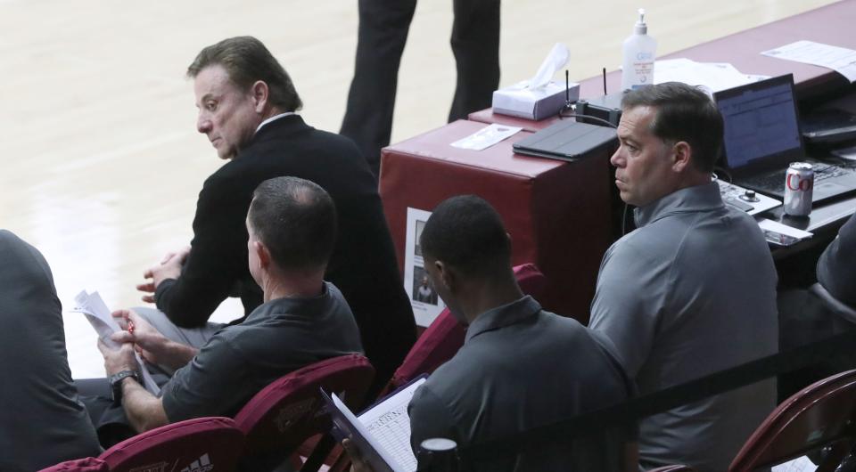 Iona head coach Rick Pitino sits in front of former Manhattan College coach Steve Masiello, far right, who was seated behind the Iona bench during a game at Iona Nov. 7, 2022. Iona beat Penn 78-50.