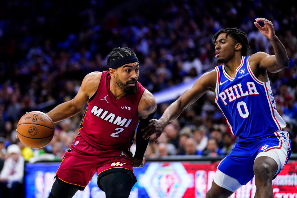 Miami Heat's Gabe Vincent, left, drives past Philadelphia 76ers' Tyrese Maxey during the first half of Game 6 of an NBA basketball second-round playoff series, Thursday, May 12, 2022, in Philadelphia. (AP Photo/Matt Slocum)