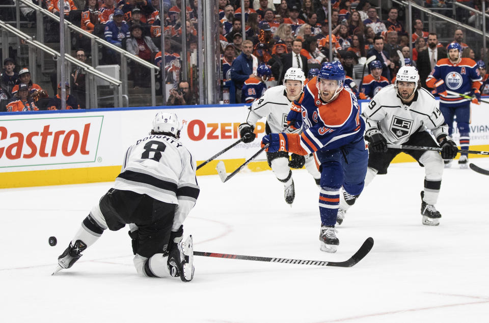 Los Angeles Kings' Drew Doughty (8) blocks a shot from Edmonton Oilers' Connor McDavid (97) during the second period of Game 5 of an NHL hockey Stanley Cup first-round playoff series Tuesday, April 25, 2023, in Edmonton, Alberta. (Jason Franson/The Canadian Press via AP