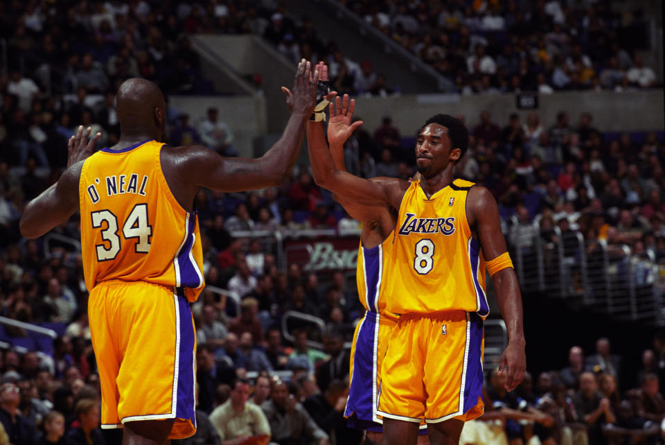 FILE:  Shaquille O'Neal and Kobe Bryant of the Los Angeles Lakers high five each other during a National Basketball Association game against the Orlando Magic at the Great Western Forum in Los Angeles, CA. (Photo by Matt A. Brown/Icon Sportswire via Getty Images)