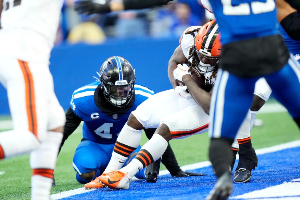 Browns running back Kareem Hunt scores on a first-half 2-yard touchdown run ahead of Colts linebacker Zaire Franklin (44), Sunday, Oct. 22, 2023, in Indianapolis.