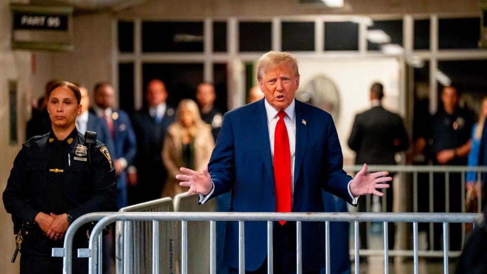 PHOTO: Former President Donald Trump speaks to the press as he arrives for his trial for allegedly covering up hush money payments linked to extramarital affairs, at Manhattan Criminal Court in New York City, Apr. 25, 2024. (Mark Peterson/AFP via Getty Images)