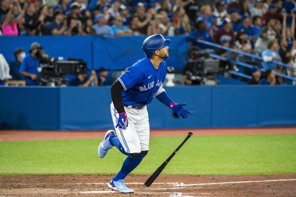 Toronto Blue Jays' George Springer (4) looks on after hitting a grand slam during the sixth inning of a baseball game against the St. Louis Cardinals, Tuesday, July 26, 2022 in Toronto. (Christopher Katsarov/The Canadian Press via AP)