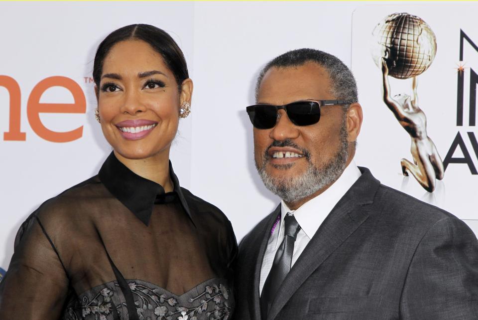 Laurence Fishburne and Gina Torres at the 46th NAACP Image Awards in Pasadena, California. REUTERS/Jonathan Alcorn