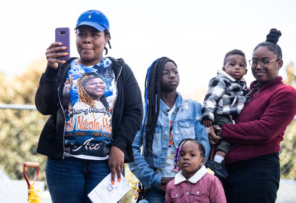 Amber Posey records the event as city officials talk about the Children's Memory Garden of Nashville in Centennial Park, Saturday, November 13, 2021 in front of the family and friends of children lost to violence. Posey lost her child, Ashanti Harris, April 9, 2020. 