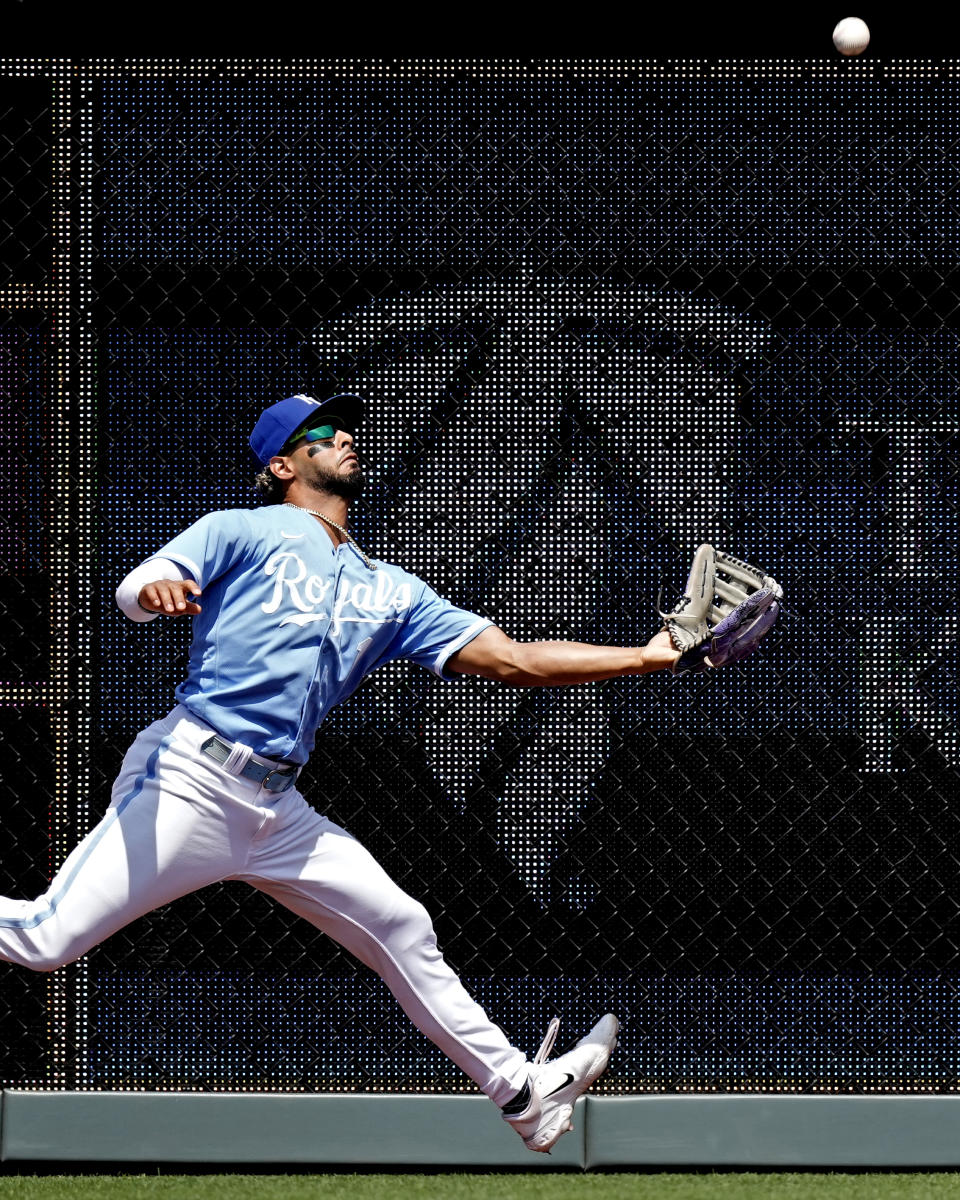 Kansas City Royals left fielder MJ Melendez catches a fly ball for the out on Seattle Mariners' Ty France during the second inning of a baseball game Thursday, Aug. 17, 2023, in Kansas City, Mo. (AP Photo/Charlie Riedel)