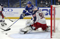 Columbus Blue Jackets goaltender Elvis Merzlikins makes a save against Tampa Bay Lightning's Ondrej Palat during the second period of an NHL hockey game Thursday, April 22, 2021, in Tampa, Fla. (AP Photo/Mike Carlson)