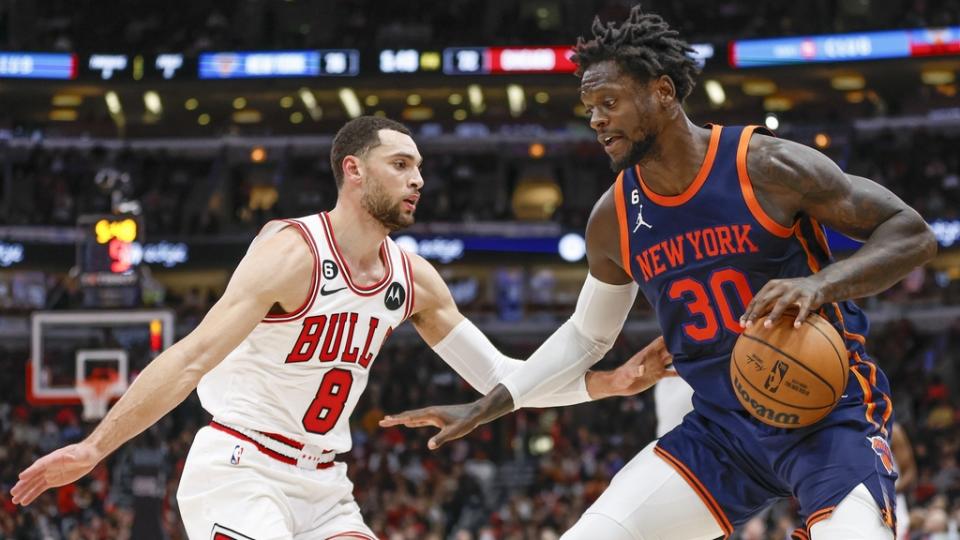 Dec 14, 2022; Chicago, Illinois, USA; New York Knicks forward Julius Randle (30) drives to the basket against Chicago Bulls guard Zach LaVine (8) during the second half at United Center.